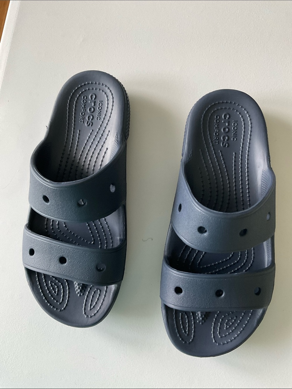 New with tags Woman’s Crocs Navy Slides Size 8